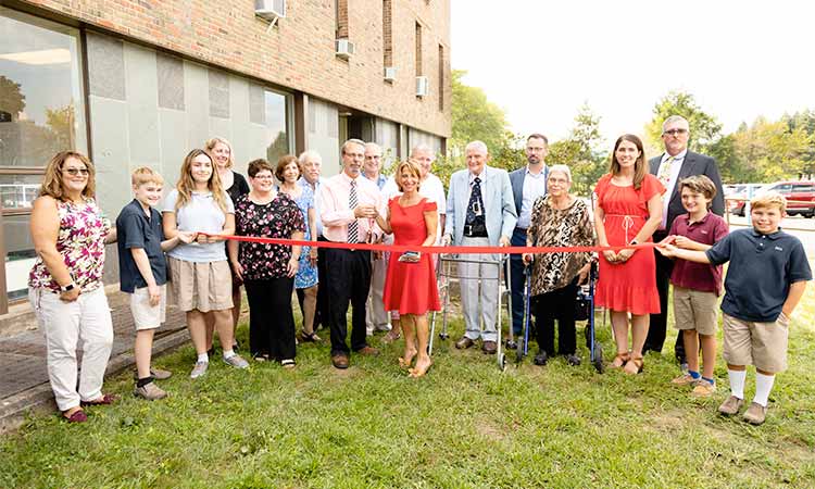 Group of people attending the ribbon cutting ceremony at Ben Bronz Academy