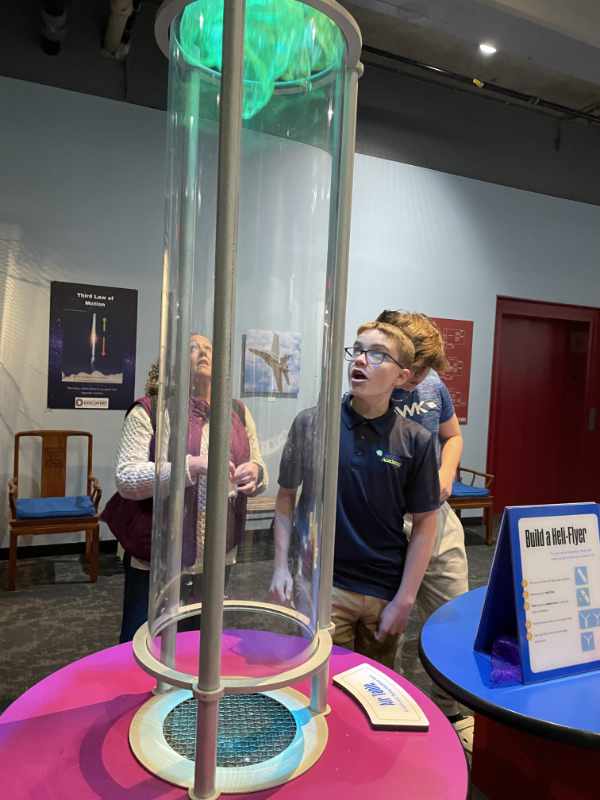Students exploring at science center.