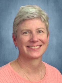 Portrait of smiling woman with short hair.