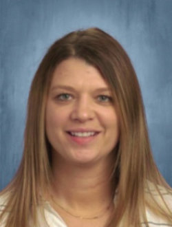 Young, smiling woman with long, dark blond hair.