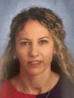 Woman with long, curly blond hair.